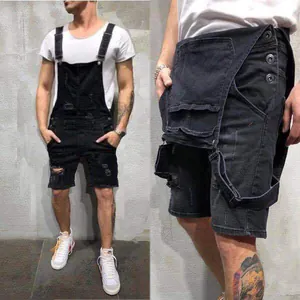 Vue détaillée de la salopette en jean noir pour hommes avec fermeture à boutons