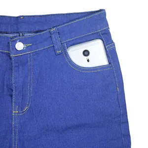 Detail of front pocket on blue stretch denim skinny jeans showing storage capacity