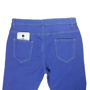 Back pocket detail of high waisted blue skinny jeans with gold contrast stitching