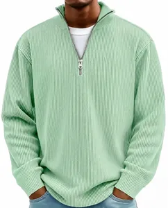 Detailed view of the sage green ribbed fabric and quarter-zip collar on this men's sweater.
