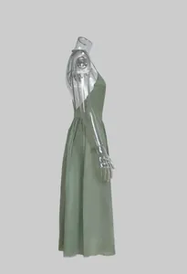 Side profile view of an elegant sage green backless V-neck maxi suspender dress for women