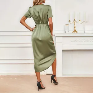 Elegant olive green satin wrap dress showing a detailed back view and pleated waist design