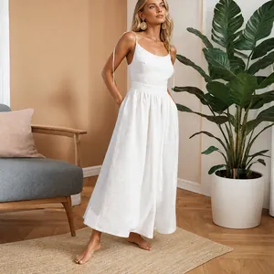 Elegant white backless maxi dress for women shown in a natural home interior setting