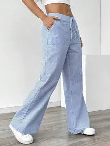 Side view detail of blue and white striped casual wide-leg pants with drawstring waist