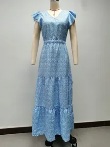 Detail view of a blue V-neck floral tiered maxi dress on a mannequin
