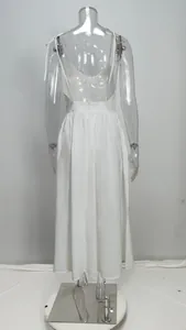 Back view of an elegant white backless high-waist maxi dress on a mannequin