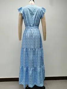 Back view of a blue floral print tiered maxi dress with flutter sleeves on a mannequin.