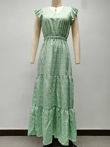 Full length detail of a green V-neck floral tiered maxi dress displayed on a mannequin