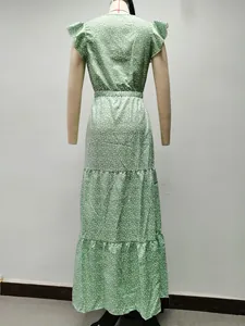 Back view of elegant green floral print tiered maxi dress with delicate flutter sleeves