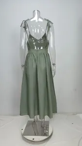 Back view of a sage green tie-shoulder midi dress with backless design on mannequin
