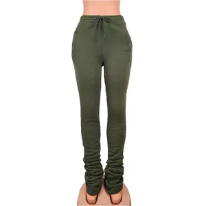 Close-up detail view of women's high-waisted olive green stacked sweatpants with drawstring