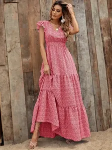 Floral print V-neck high waist tiered maxi dress shown on model against rustic wood background