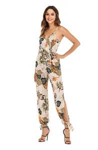 Full view of women's floral jumpsuit with tropical print and side slit leg design