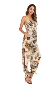 Full-length view of a floral printed V-neck jumpsuit with stylish side slits.