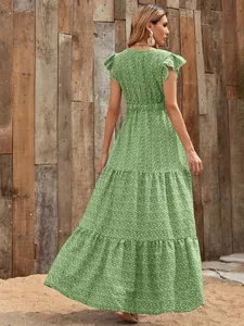 Back view of a green floral v-neck high-waist tiered maxi dress with ruffled sleeves.