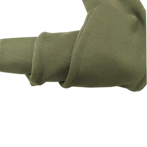 Close-up detail of the olive green soft knit fabric and slouchy trouser leg design