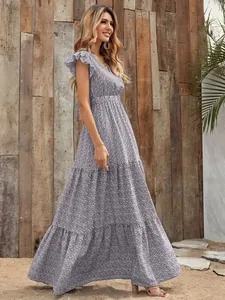 Full view of floral V-neck tiered maxi dress with ruffled short sleeves in outdoor setting
