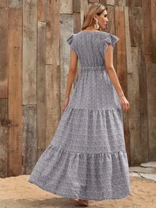 Back view of a tiered floral print maxi dress with high waist and flutter sleeves