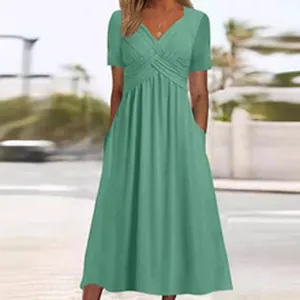 Detailed view of women's mint green pleated V-neck maxi dress with side pockets.