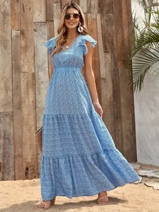 Detailed view of a summer blue floral print maxi dress with V-neck and tiered skirt