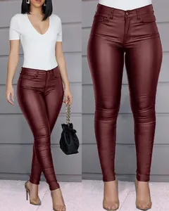 Close-up detail of wine red PU leather skinny pants with slim fit fashion design