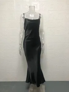Elegant black satin mermaid maxi dress with delicate spaghetti straps on mannequin display