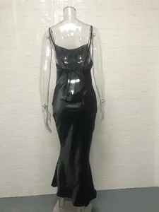 Rear view of black backless satin fishtail dress with adjustable tie-up straps