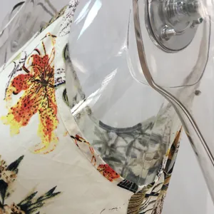 Close-up detail of vibrant lily print on a spring floral cotton jumpsuit for women