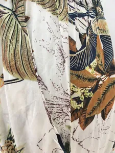 Detailed close-up shot of the vibrant tropical leaf pattern on soft cotton fabric