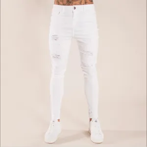 Trendy men's white distressed skinny jeans with ripped details for a modern slim look