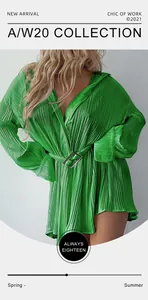Detailed view of a green pleated long sleeve shirt dress featuring a belted waist line.