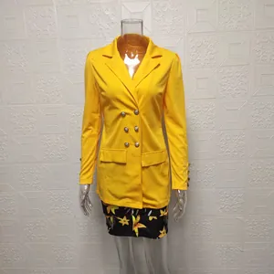 Elegant yellow double-breasted blazer and floral print mini skirt two-piece set on mannequin