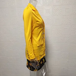 Side view of yellow slim fit blazer and floral print mini skirt two-piece set