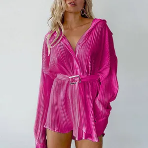 Vibrant fuchsia pleated long-sleeve shirt dress with a stylish buckled waist belt