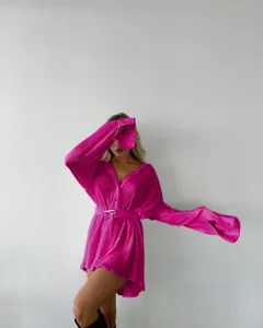 Detailed shot of vibrant fuchsia pleated long-sleeve belted shirt dress for women
