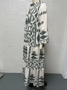 Side-view detail of an elegant bohemian plus size maxi shirt dress with geometric print