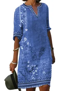 Detailed view of the blue ethnic floral print and elegant V-neck on this casual dress