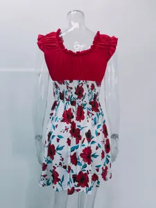 Detail view of an elegant summer floral dress with red ruffled bodice and U-neckline