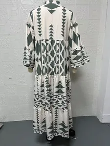 Detailed back view of a bohemian printed maxi shirt dress with green geometric patterns