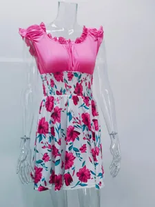 Elegant women's summer dress featuring a pink ruffle top and floral print skirt