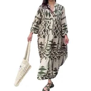 Detailed view of a bohemian geometric print maxi shirt dress with a tiered skirt design