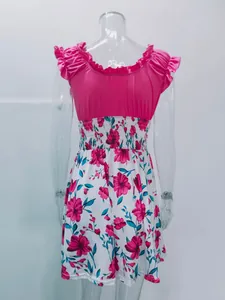 Elegant summer dress featuring a pink ruffled U-neck top and floral print skirt.