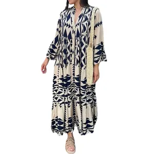 Detailed view of an elegant bohemian printed shirt maxi dress with geometric patterns and tiered skirt