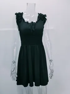 Elegant black U-neck summer dress featuring ruffled shoulders and a smocked waistline