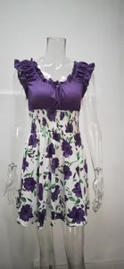 Detail view of elegant purple floral polyester dress with U-neck and elastic waist design
