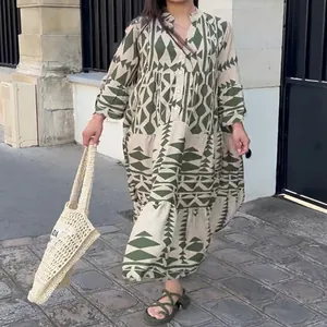 Elegant bohemian printed maxi shirt dress for women shown in a casual street style setting