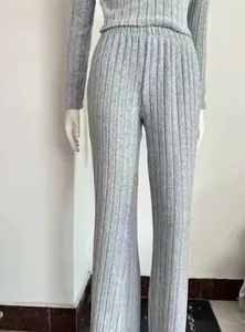 Grey ribbed knit set with long-sleeve crop top and wide-leg pants on mannequin