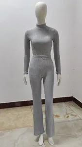 Detailed view of grey ribbed knit two-piece set with cropped top and flared pants