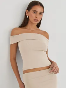 Close-up of beige off-the-shoulder slim fit top showing fabric texture and neckline