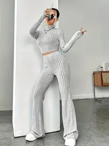 Grey ribbed knit two-piece set featuring slim crop top and high-waisted flared pants